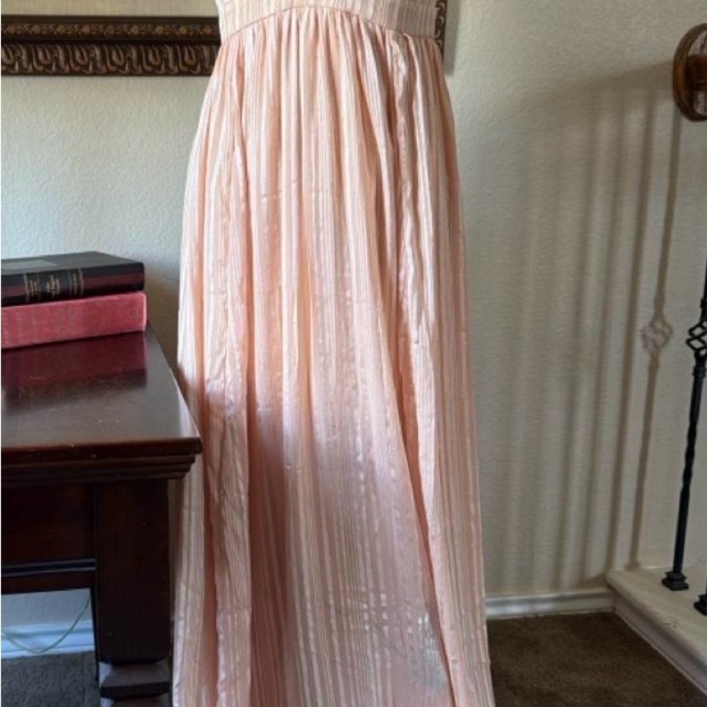 the clothing company Peach Pleated Maxi Dress